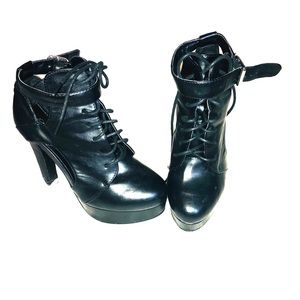 Black heels that lace up an buckle on the side